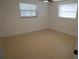 Bedroom featuring tile flooring, a ceiling fan, and natural light at 7534 Mako Dr, Hudson, FL 34667
