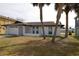 Charming single-story home featuring a fresh white paint job and a two-car garage at 7534 Mako Dr, Hudson, FL 34667