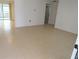 Open concept living room featuring tile flooring and neutral color palette at 7534 Mako Dr, Hudson, FL 34667