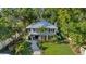 Aerial view of a charming two-story home with a well-maintained lawn and mature trees at 8020 Sharon Dr, Tampa, FL 33617