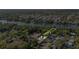 An aerial view showing the layout of a property with river access, a pool, and a well-manicured lawn at 8020 Sharon Dr, Tampa, FL 33617