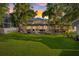 Backyard with fire pit and patio in beautiful sunset at 8020 Sharon Dr, Tampa, FL 33617