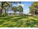 A vast green backyard with trees near the water at 8020 Sharon Dr, Tampa, FL 33617