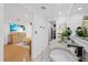 Bathroom featuring single sink vanity, marble countertop, closet and bedroom views at 8020 Sharon Dr, Tampa, FL 33617