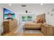 Bright main bedroom with hardwood floors, ceiling fan, and sliding doors to a deck at 8020 Sharon Dr, Tampa, FL 33617