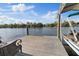 A lovely dock overlooking the water with an attached boat at 8020 Sharon Dr, Tampa, FL 33617