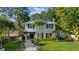 Charming two-story home with a manicured lawn, walkway, and inviting entryway, offering classic curb appeal at 8020 Sharon Dr, Tampa, FL 33617