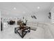 Spacious living room with white marble floors, white sofa and modern decor, great for entertaining and relaxation at 8020 Sharon Dr, Tampa, FL 33617