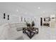 Spacious living room with white marble floors, white sofa and modern decor, great for entertaining and relaxation at 8020 Sharon Dr, Tampa, FL 33617