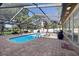 A private screened-in pool area with a pool and plenty of room for chairs and tables at 8020 Sharon Dr, Tampa, FL 33617