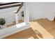 Light wood steps with cable railing leads to the next level of the home at 8020 Sharon Dr, Tampa, FL 33617