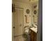 A well-lit bathroom featuring a sink vanity and toilet at 8119 Oak Trace Way # C, Tampa, FL 33634