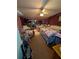 View of the bedroom with floral-themed bedding, decor, and large closet at 8119 Oak Trace Way # C, Tampa, FL 33634