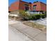 Exterior view of a two-story townhome with a red tile roof and a white fence at 8119 Oak Trace Way # C, Tampa, FL 33634