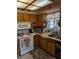 A cozy kitchen showcasing oak cabinets, and standard white appliances at 8119 Oak Trace Way # C, Tampa, FL 33634