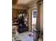 A functional kitchen with oak cabinets, black refrigerator, and tile flooring at 8119 Oak Trace Way # C, Tampa, FL 33634