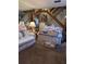 A comfortable living room featuring stairs, carpeted floor, and a mirrored wall at 8119 Oak Trace Way # C, Tampa, FL 33634