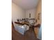 A carpeted staircase displaying multiple pictures, shelving decor, and a wooden handrail at 8119 Oak Trace Way # C, Tampa, FL 33634