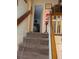 A carpeted stairway leading upstairs at 8119 Oak Trace Way # C, Tampa, FL 33634
