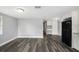 Open concept kitchen and living area with modern appliances and stylish flooring at 8624 N Semmes St, Tampa, FL 33604