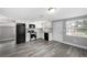 Spacious kitchen with stainless steel appliances, white cabinets and granite countertops at 8624 N Semmes St, Tampa, FL 33604