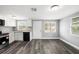 Well-lit kitchen with gray walls, white cabinets, granite countertops, and modern appliances at 8624 N Semmes St, Tampa, FL 33604