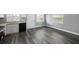Open concept kitchen with new black appliances and new granite countertop at 8624 N Semmes St, Tampa, FL 33604
