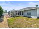 View of the backyard and screened in patio with seating offering comfortable outdoor living at 8702 Pinafore Dr, New Port Richey, FL 34653