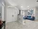 Foyer with double front doors, transom window, tile floors, and an adjacent sitting area at 8702 Pinafore Dr, New Port Richey, FL 34653