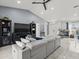 Vaulted ceiling living room showcasing updated floors, neutral paint, and entertainment center at 8702 Pinafore Dr, New Port Richey, FL 34653