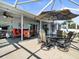 Large covered lanai with dining and seating area; a delightful area for relaxation and gatherings at 8702 Pinafore Dr, New Port Richey, FL 34653