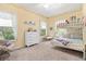 Bright, cheerful bedroom with ceiling fan, bunk beds, and a window view at 9019 Stone Dr, Webster, FL 33597