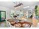 Charming dining area featuring a view into the kitchen, beautiful decor, and easy access to the cozy living area at 9019 Stone Dr, Webster, FL 33597