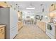 Bright kitchen featuring a spacious layout, skylight, extensive cabinetry, and adjacent dining area, perfect for Gathering gatherings at 9019 Stone Dr, Webster, FL 33597