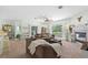 Relaxing living room with fireplace, ceiling fan, and sliding glass doors to balcony at 9019 Stone Dr, Webster, FL 33597