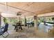 Spacious ground floor entertaining space featuring picnic table and foosball, lit with string lights at 9019 Stone Dr, Webster, FL 33597