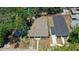 An aerial view showing the house's roof, yard, and proximity to surrounding neighborhood homes at 906 E Patterson St, Tampa, FL 33604