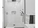 Modern bathroom with tiled shower, sleek fixtures, and glass door at 906 E Patterson St, Tampa, FL 33604