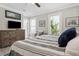 Comfortable bedroom with dresser, windows, and relaxing decor at 906 E Patterson St, Tampa, FL 33604