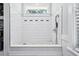 Tiled dog shower station with handheld sprayer and bone-shaped hooks at 906 E Patterson St, Tampa, FL 33604
