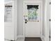 Charming white front door with glass window and decorative bow at 906 E Patterson St, Tampa, FL 33604
