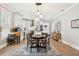Bright kitchen featuring a dining area, modern appliances, white cabinetry, and stylish pendant lighting at 906 E Patterson St, Tampa, FL 33604
