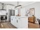 Modern kitchen with white cabinets, stainless steel appliances and kitchen island at 906 E Patterson St, Tampa, FL 33604