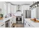Stylish kitchen featuring white cabinets, stainless steel appliances, and a functional layout at 906 E Patterson St, Tampa, FL 33604