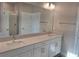 Bathroom featuring double sinks, ample countertop space, and modern fixtures at 9943 Campanula Ct, Land O Lakes, FL 34637