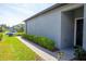 Landscaped front yard with brick walkway and lush green lawn leading to the front door at 9943 Campanula Ct, Land O Lakes, FL 34637