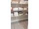 Organized linen closet features neatly stacked towels and sheets on wire shelving at 9943 Campanula Ct, Land O Lakes, FL 34637