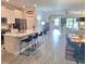 Open-concept living showcasing the kitchen island, dining area, and living room at 9943 Campanula Ct, Land O Lakes, FL 34637