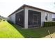 Spacious screened patio with black aluminum frame, great for outdoor living at 9943 Campanula Ct, Land O Lakes, FL 34637