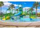 Community splash pad featuring water slides, sprayers and palm trees at 9943 Campanula Ct, Land O Lakes, FL 34637